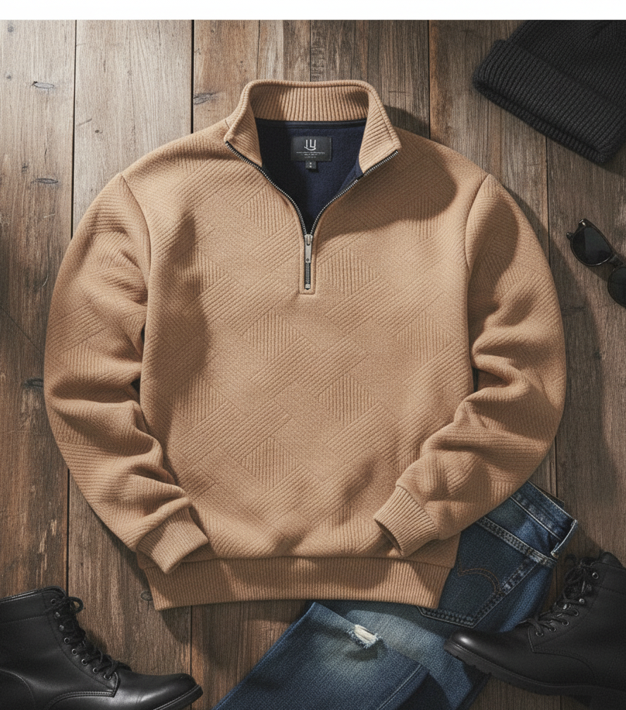 Beige half-zip sweater on a wooden surface with jeans and boots.